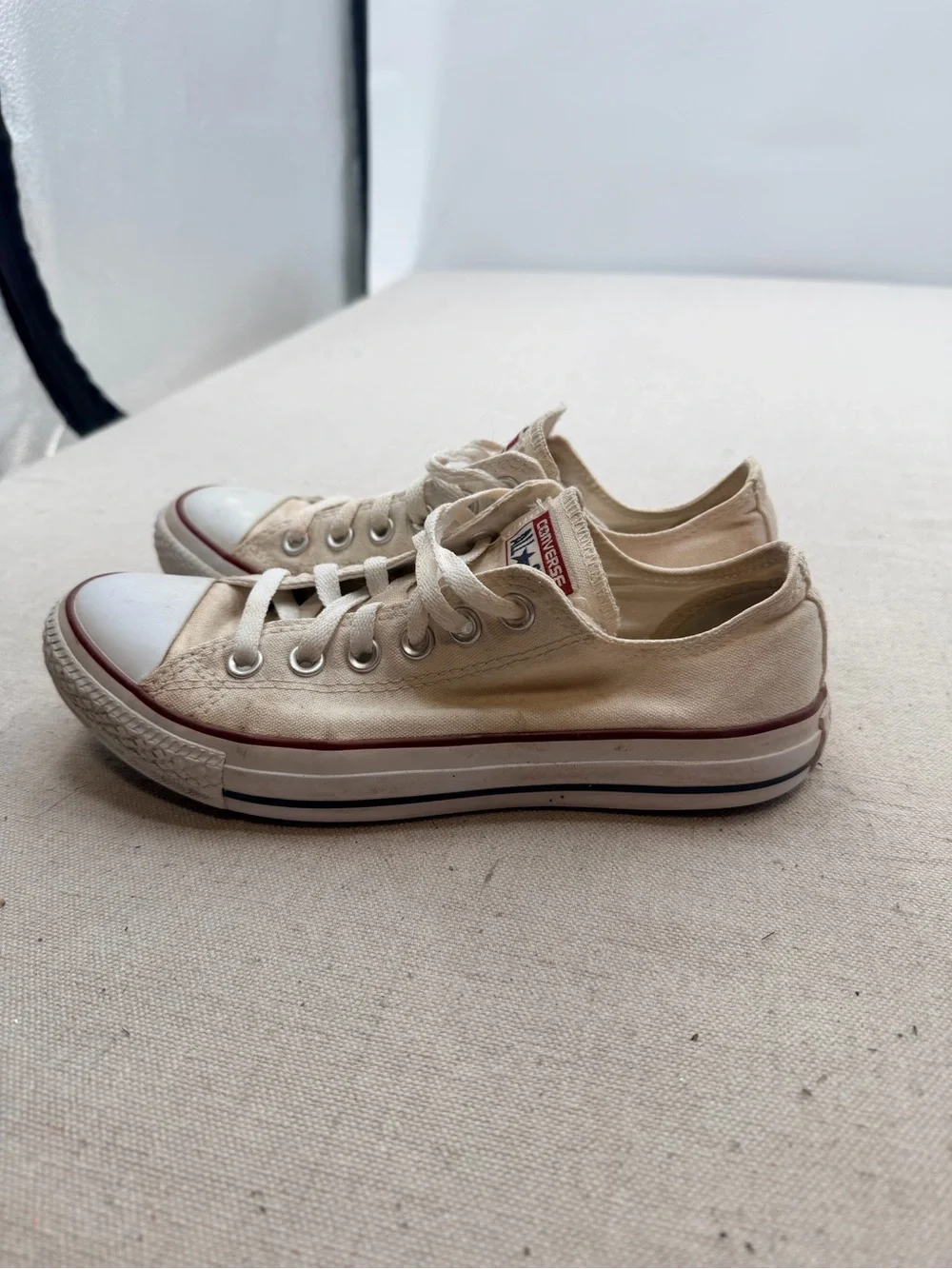 Converse Low Top Sneakers in Cream with Red Trim